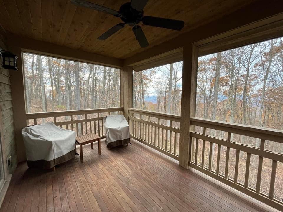 Screened porch with forest view