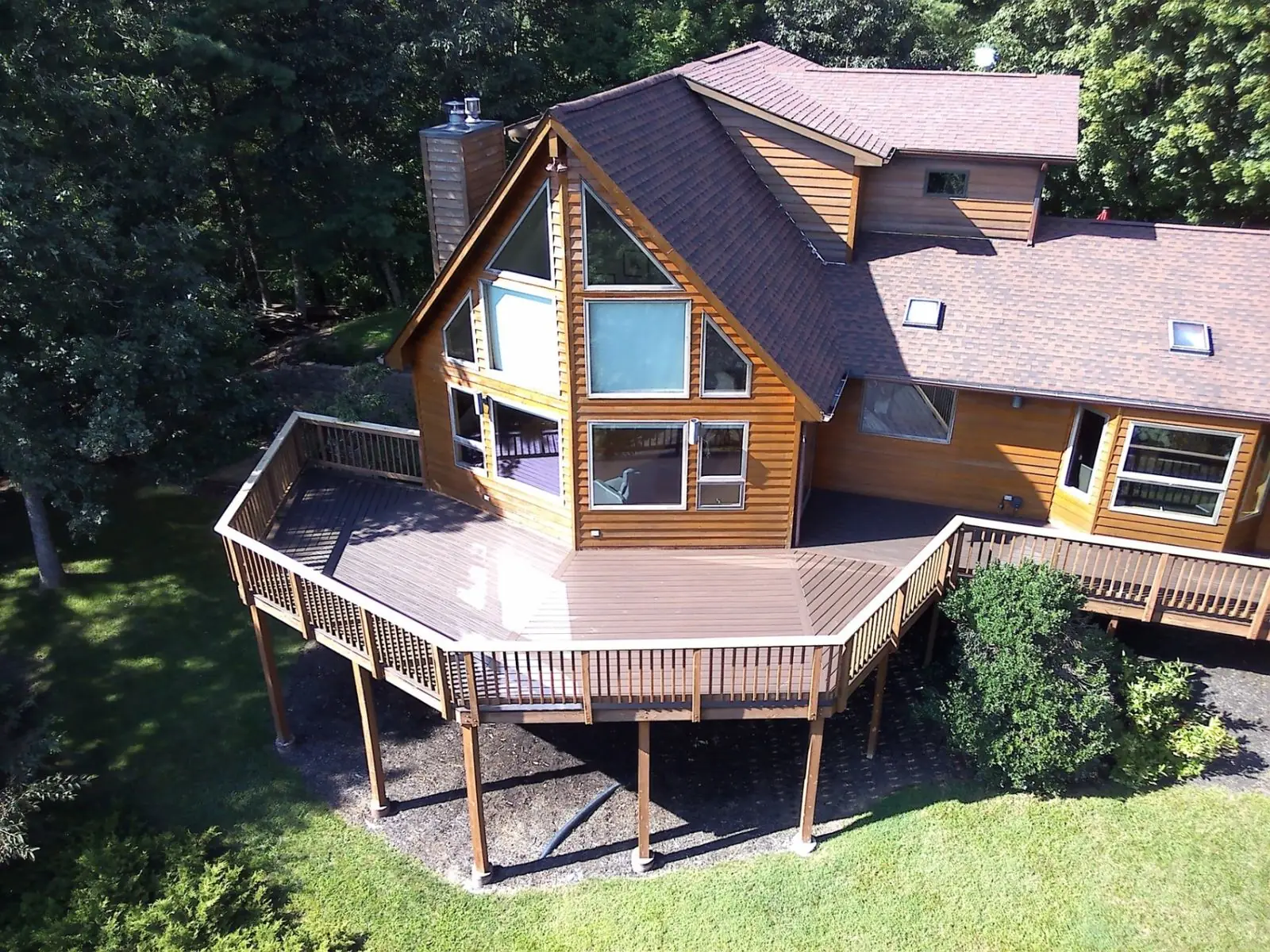 Aerial view of wraparound deck on A-frame home