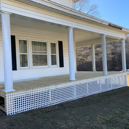 Classic white porch with lattice skirting