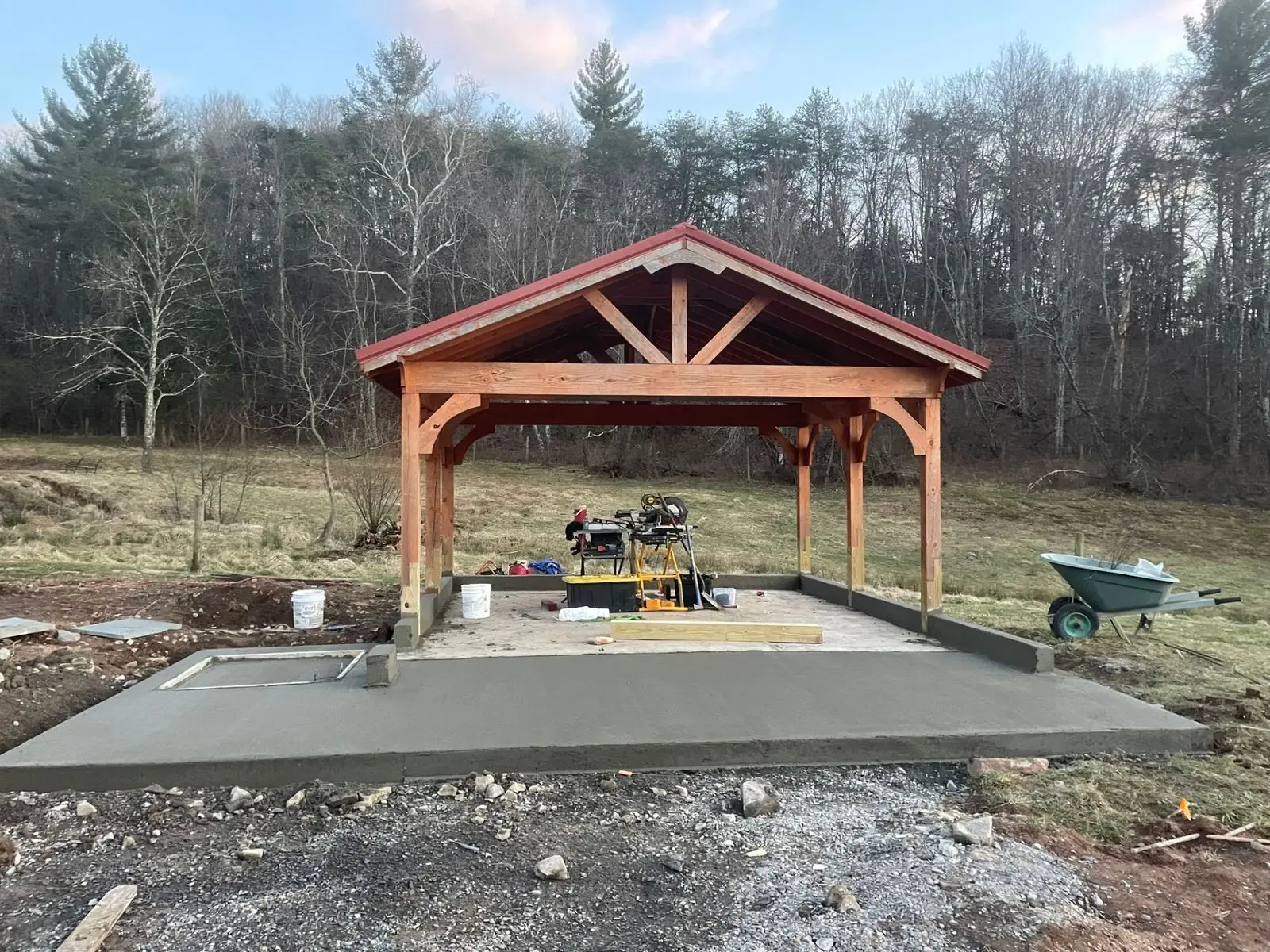 Timber frame pavilion with red metal roof