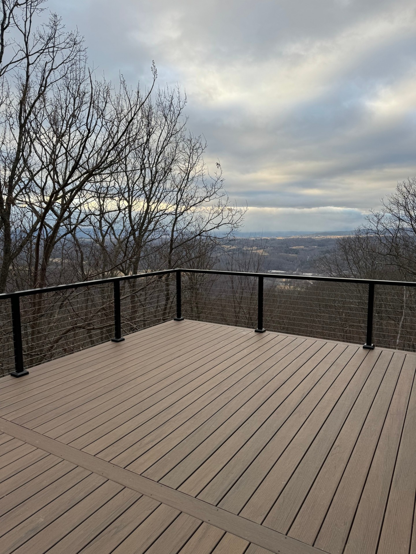 Composite deck overlooking valley with cable railing