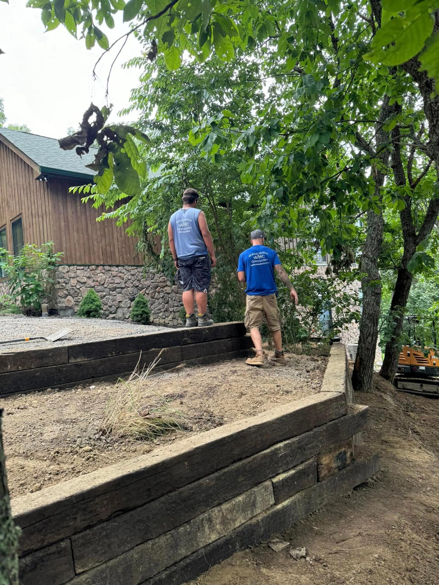 Crew working on timber retaining wall