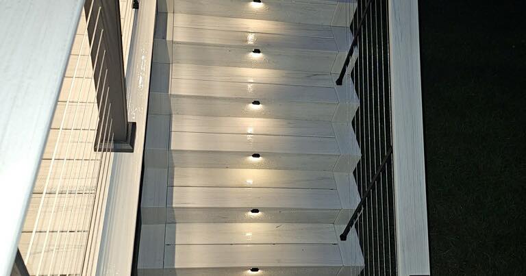 Composite deck stairs with LED step lighting